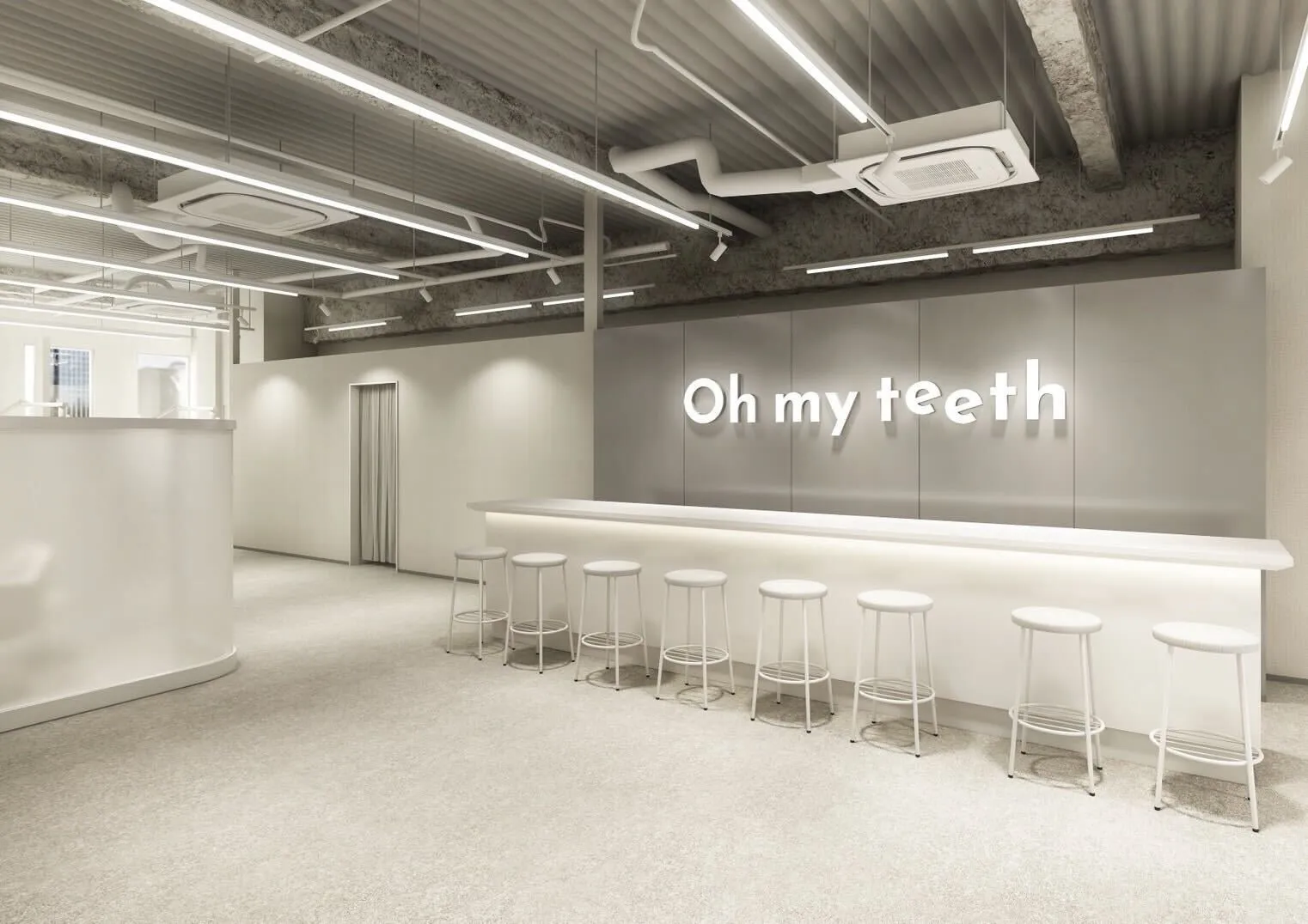白を基調とした内装の歯科医院の様子です。「Oh my teeth」という看板が目立ちます。カウンターには丸椅子が並べられ、スタイリッシュな空間を演出しています。