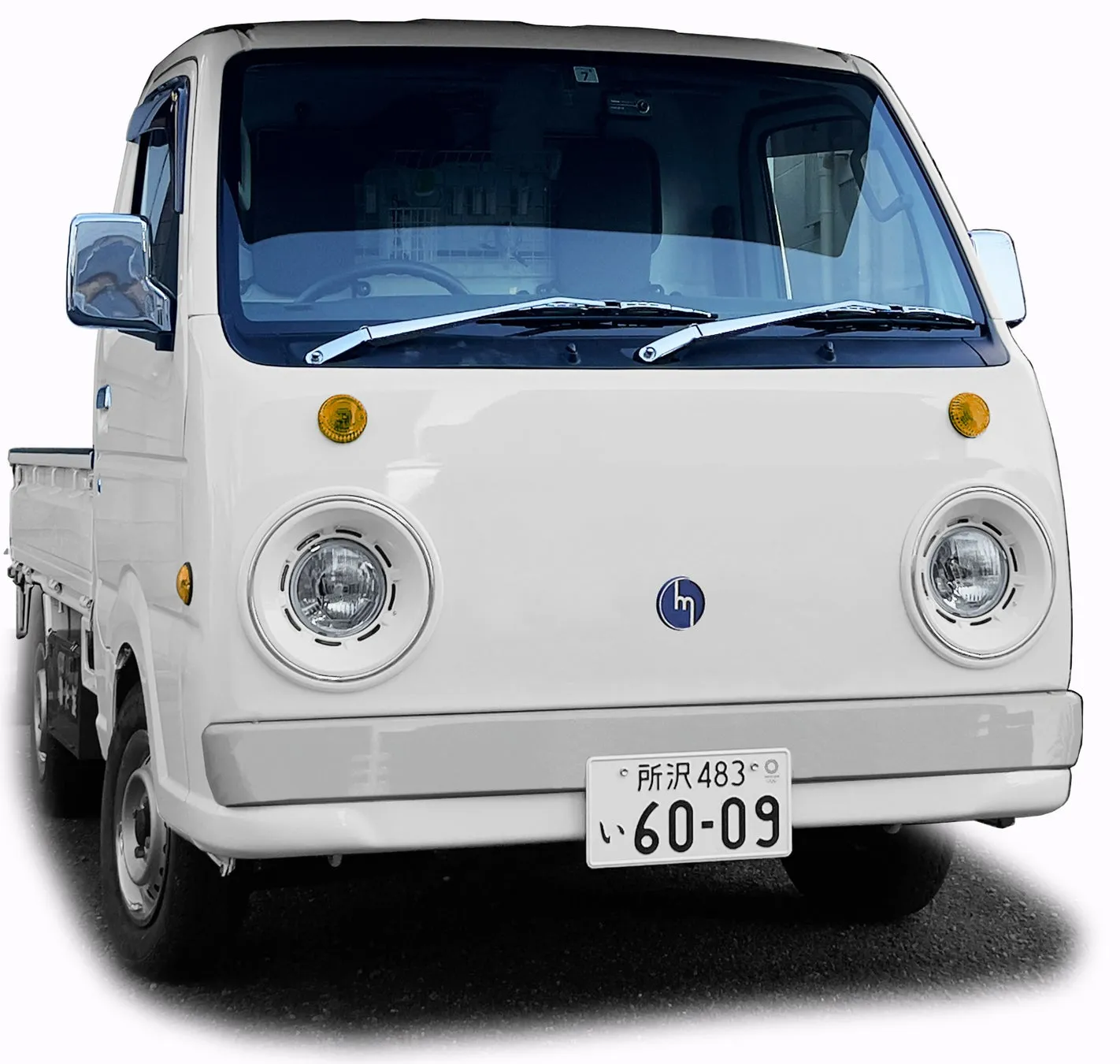 白い軽トラックの正面画像、ナンバープレート「所沢 483 い 60-09